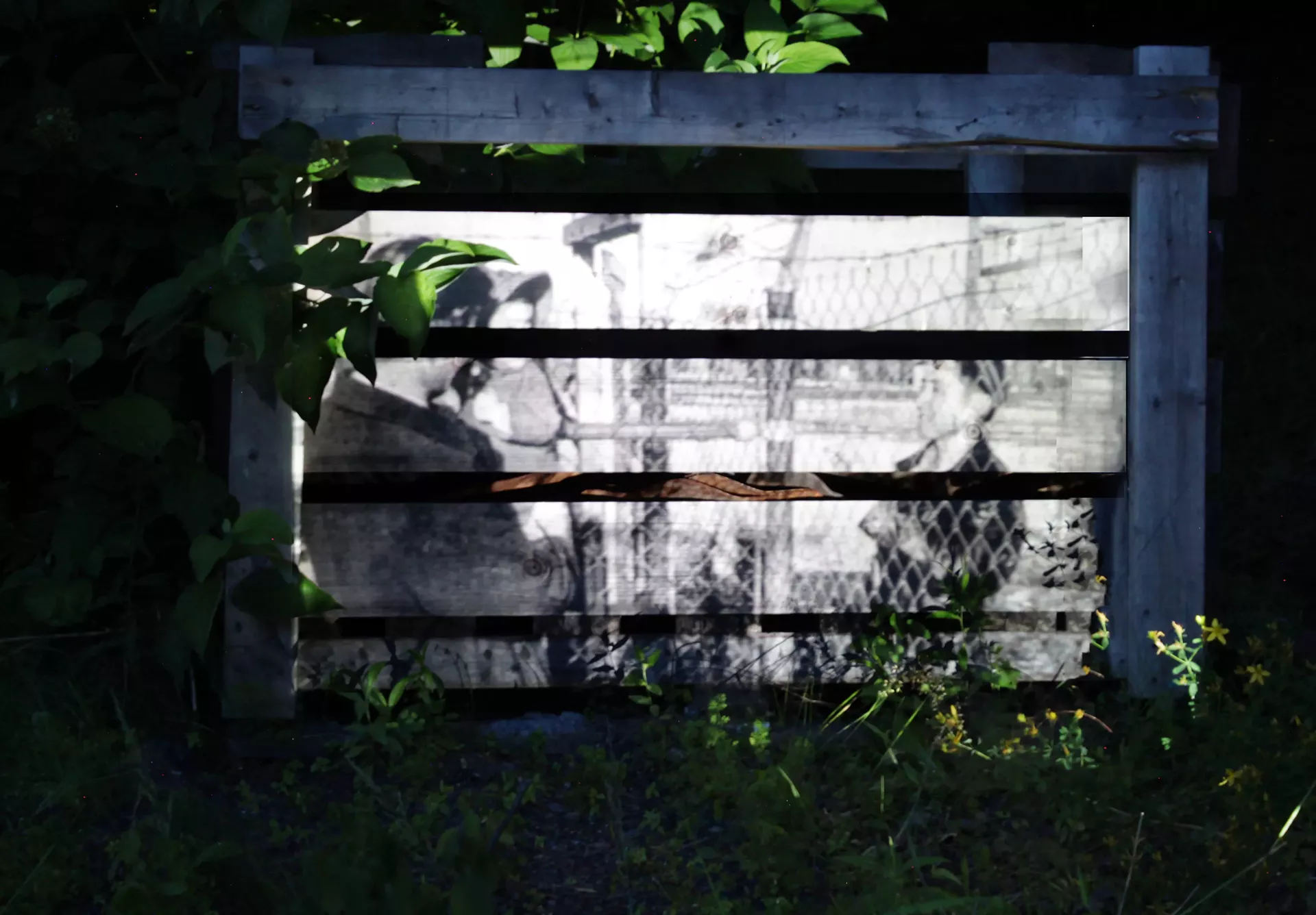 &ldquo;Boy behind barb wire fence, Tule Lake,&rdquo; projected image on broken fence by Elliott Katz