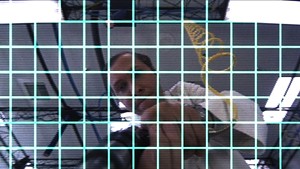 A technician adjusts RoboCop's view screen.