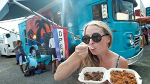 Andrea Haney enjoying jerk chicken and rice and peas at the Champlain Valley Fair