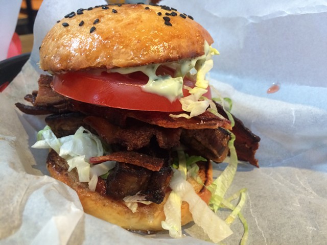 ArtsRiot's burger is a serious affair, but it's not gratuitously large. - ALICE LEVITT