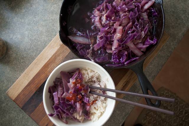 Cider-braised cabbage, served with rice and Sriracha - HANNAH PALMER EGAN