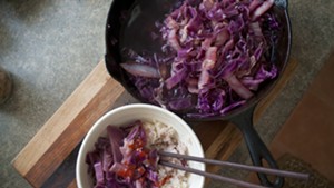 Cider-braised cabbage, served with rice and Sriracha