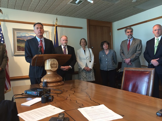 Gov. Peter Shumlin, with DCF Commissioner Dave Yacovone at his left, announces a series of reforms to the agency in response to two recent child deaths. - MARK DAVIS