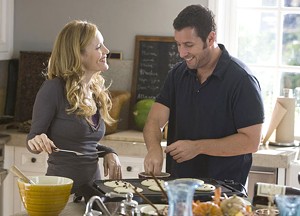 HALF-BAKED Sandler and Mann have an extraneous romance in Apatow&#8217;s very long comedy.