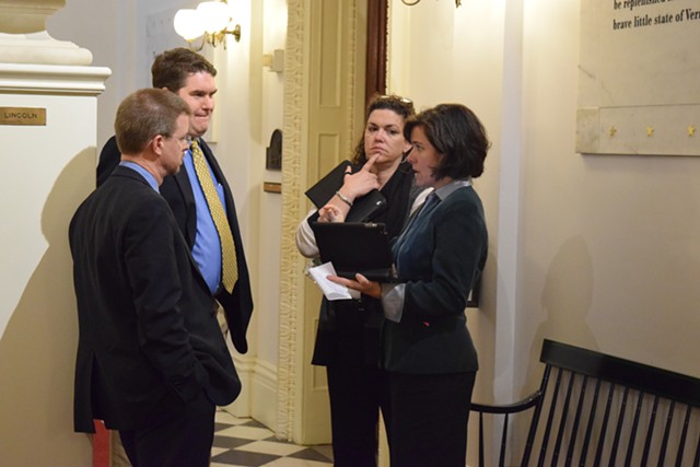 House Speaker Shap Smith (D-Morristown), left, talks Wednesday with Reps. Oliver Olsen (I-Londonderry), Laura Sibilia (I-Dover) and Mitzi Johnson (D-Grand Isle)  about an education consolidation bill. - TERRI HALLENBECK