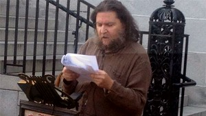 Marc Awodey, reading in front of Burlington City Hall in August 2012