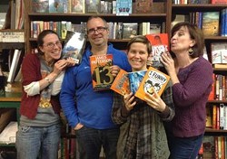 Bear Pond staff celebrate the grant. From left to right: Amanda Menard, Chris MacDonald, store owner Claire Benedict; in front, children's room manager Jane Knight. - COURTESY OF BEAR POND BOOKS