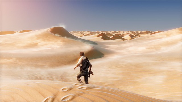 Nathan Drake treks through the desert in Uncharted 3 - NAUGHTY DOG STUDIOS