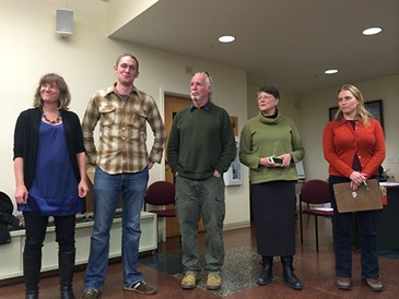 Progressive candidates Selene Colburn, Max Tracy, Jane Knodell and Sara Giannoni surround mayoral candidate Steve Goodkind at a January nominating caucus. - ALICIA FREESE