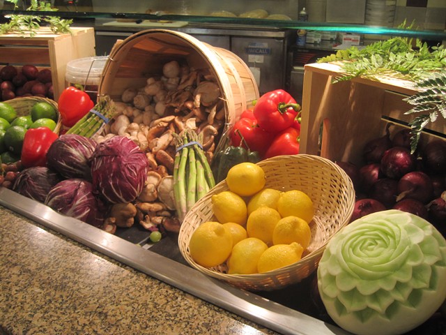 Representative produce, including a melon carved by chef Marin
