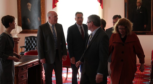 Senators escort Gov. Peter Shumlin (center) from his ceremonial office to the Senate chamber. - PAUL HEINTZ