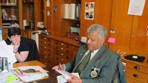 Sergeant-at-Arms Francis Brooks works in his Statehouse office Thursday morning.