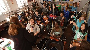 Students at IAA and their violins