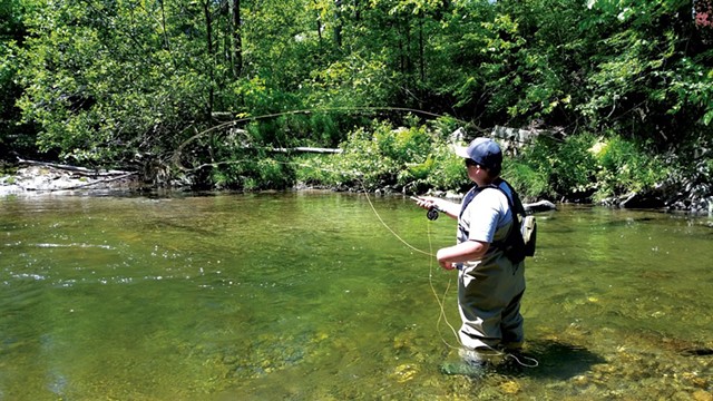 Zach Favreau fishing in the Brewster River - SARAH YAHM