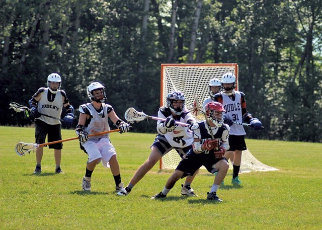 Boys playing lacrosse at Camp Dudley - COURTESY OF CAMP DUDLEY