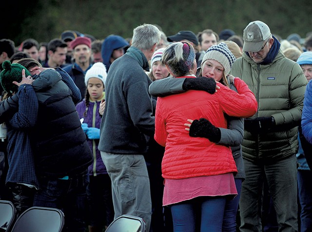 Mourners embracing during a vigil at Harwood Union High School for the teenagers killed in the 2016 crash - FILE: STEFAN HARD
