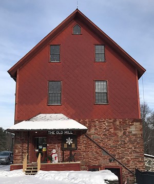 The Old Red Mill on Route 15, site of the Jericho Historical Society - SUZANNE M. PODHAIZER