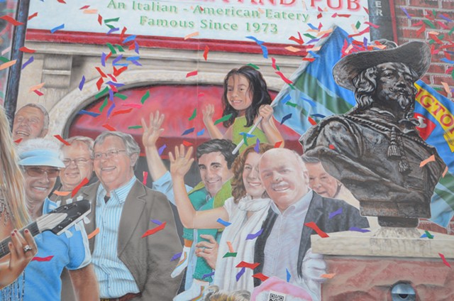 Miro Weinberger, with his daughter Li Lin sitting astride his shoulders, in the "Everyone Loves a Parade" mural - KATIE JICKLING