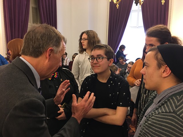 Gov. Phil Scott speaking with Alex Escaja-Heiss of South Burlington and Nathan DeGroot of Worcester - JOHN WALTERS