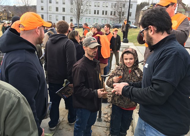 RECOIL Magazine executive director Rob Curtis handing out free 30-round magazines, - JOHN WALTERS