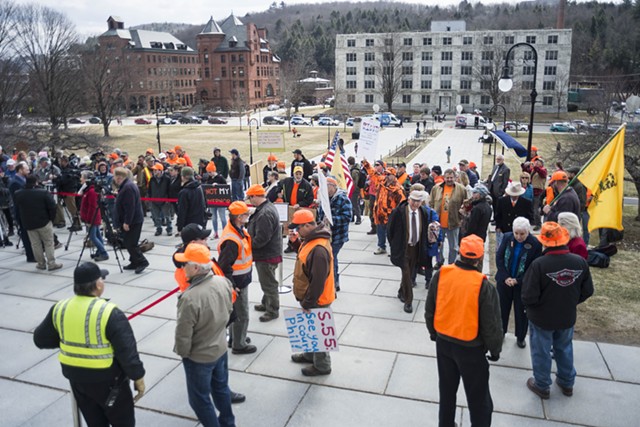 Citizens opposed to the new gun legislation gather at the Statehouse before last Wednesday's ceremony. - FILE: JOSH KUCKENS