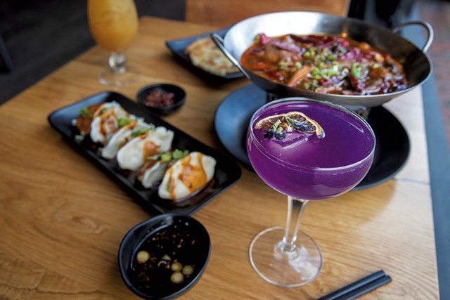 House cocktail with butterfly pea flower, Mongolian lamb with hot chile, scallion pancake and Sichuan spicy dumplings at Mandarin in Winooski - JAMES BUCK