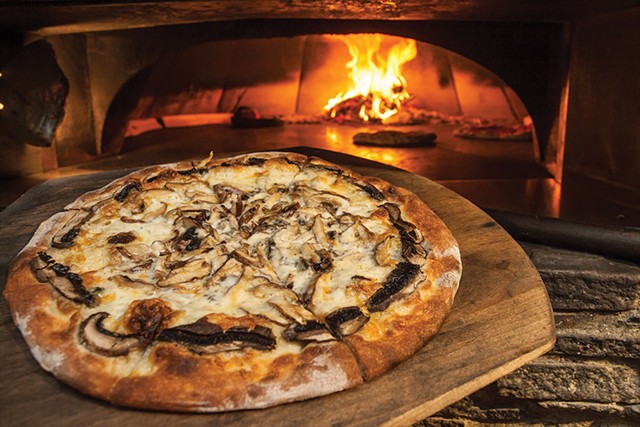 Wild mushroom with caramelized onions and gooey mozzarella pizza at Depot62 - TOM MCNEILL