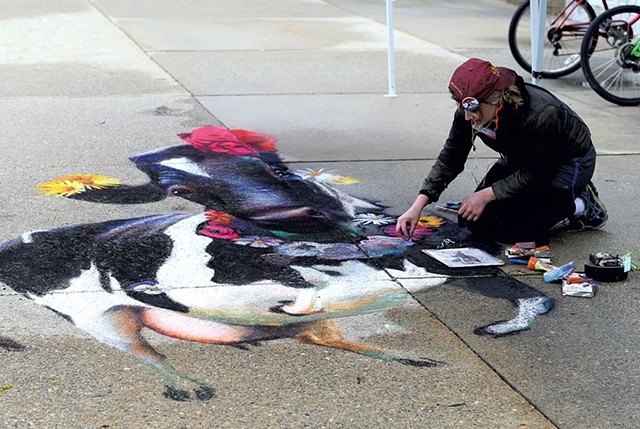 Katie Runde working on a cow chalk mural at Middlebury College - CALEB KENNA