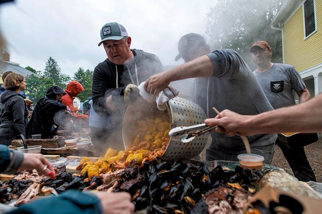 Eric Warnstedt (left) and Will McNeill (center) serving a high-country shrimp boil at 18 Elm - GLENN RUSSELL