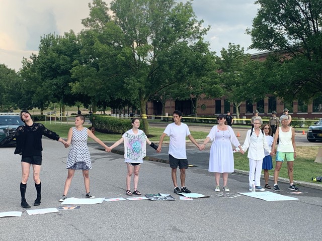 Protesters blocking the road in front of ICE's Williston intelligence center - DEREK BROUWER