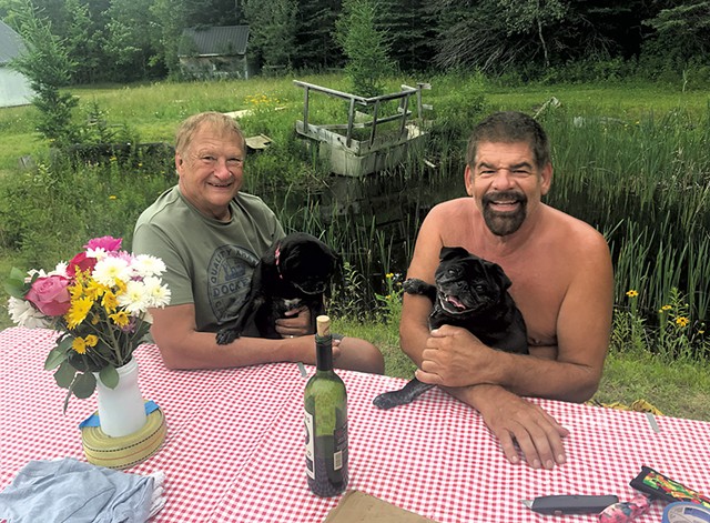Craig Geisler (left) and Jeff Jensen with their pugs, Rico and Suave - CHELSEA EDGAR