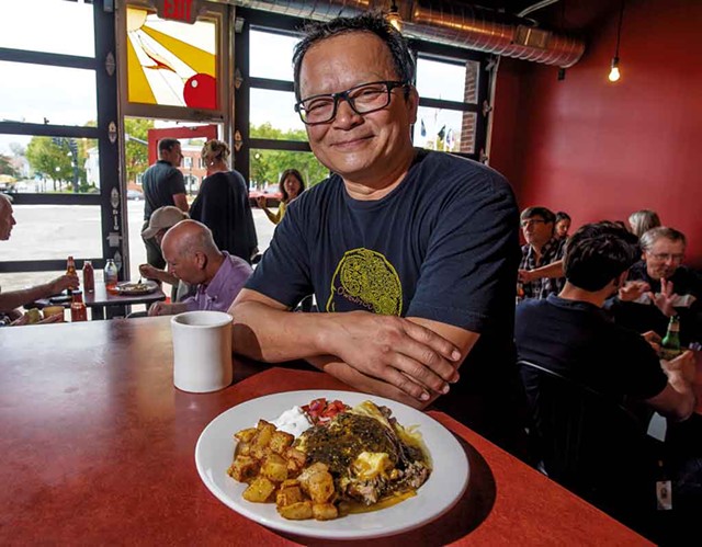Owner Jake Tran with a pork carnitas omelette at the Firebird Caf&eacute; - GLENN RUSSELL