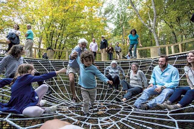 Visitors enjoying the giant spiderweb - TOM MCNEILL