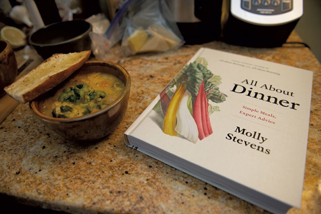 Vegetable-and-lentil soup alongside Molly Stevens' cookbook All About Dinner - DARIA BISHOP