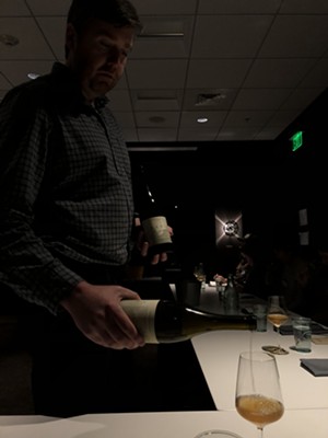Matt Canning pouring wine for workshop participants - JORDAN BARRY