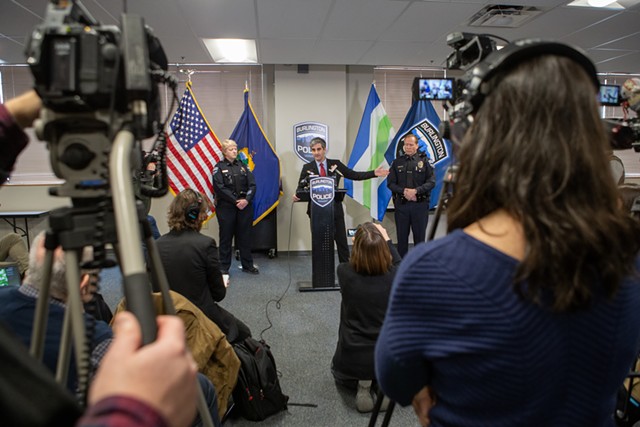 Media members listen to Mayor Miro Weinberger, at podium - LUKE AWTRY