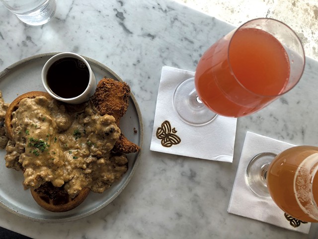 Half order of chicken and waffles at Monarch &amp; the Milkweed, with brunch beverages - JORDAN BARRY