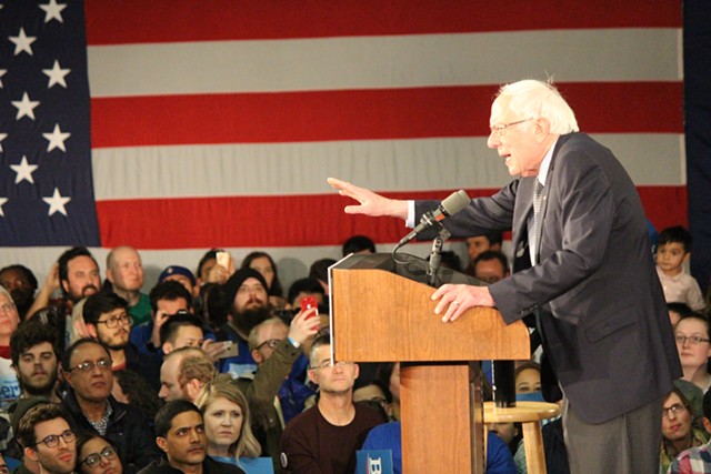 Sen. Bernie Sanders addresses supporters Monday night in Des Moines - PAUL HEINTZ