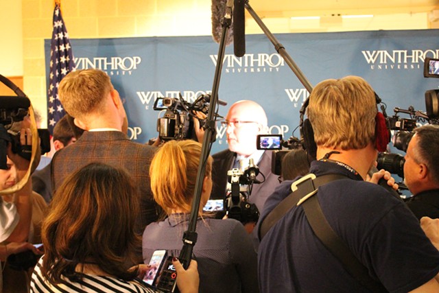 Sanders campaign manager Jeff Weaver, center, addresses reporters in the spin room after the forum - PAUL HEINTZ