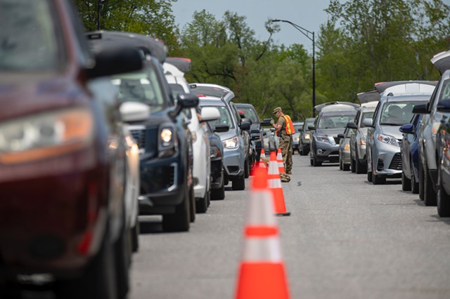 Cars lined up for food Tuesday on the Beltline in Burlington - JAMES BUCK