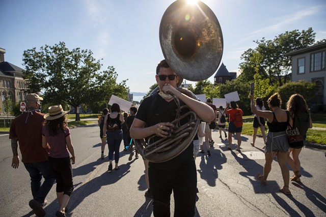This protester played a sousaphone - JAMES BUCK