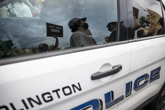 Demonstrators passing a police car in Burlington - FILE: JAMES BUCK
