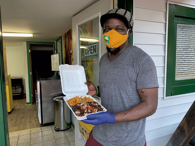 Bilon "Richie" Bailey with takeout from Jamaican Supreme - MELISSA PASANEN