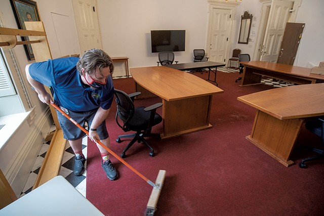 Custodian Mike Metcalf readying the coatroom at the Statehouse - JEB WALLACE-BRODEUR