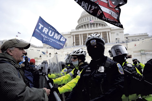 Trump supporters and police officers at Capitol Hill on January 6 - &copy; DREAMSTIME.COM/JULIAN LESHAY