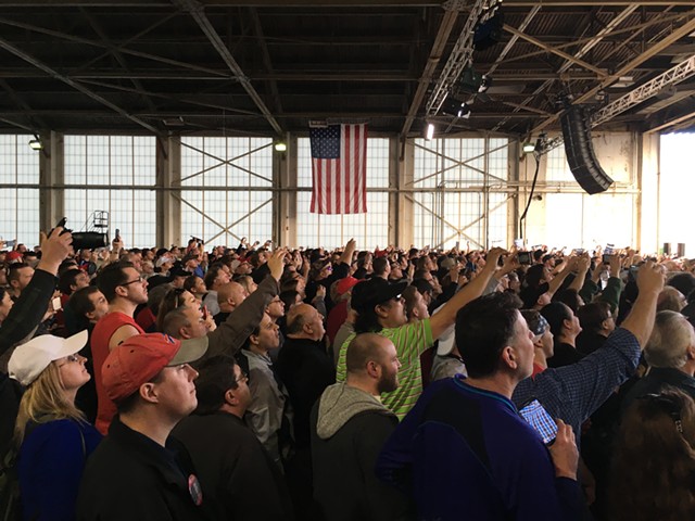 Trump supporters watch their candidate's plane pull up to a hangar at Youngstown-Warren Regional Airport Monday in Ohio. - PAUL HEINTZ