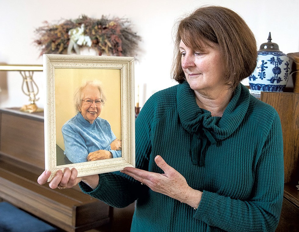 Pam Reith holding a photo of her mother, Beverly Peters - JAMES BUCK