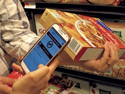 Scanning a cereal box with the WICShopper app - MATTHEW THORSEN