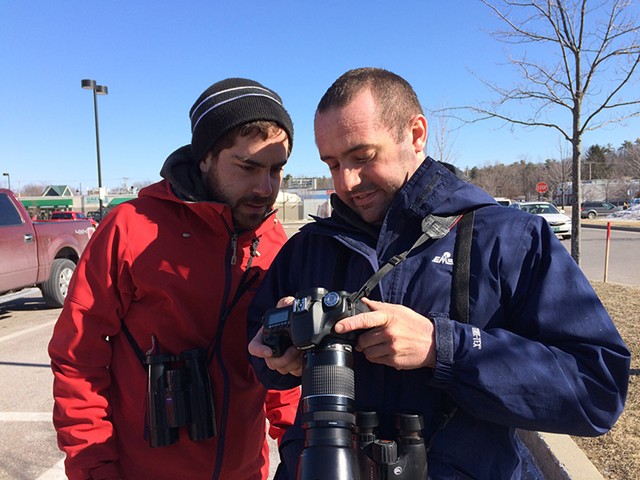 Taj Schottland (left) checking out bird photos with fellow birder Zac Cota - COURTESY OF MEGHAN OLIVER