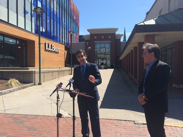 Mayor Miro Weinberger, left, and Don Sinex discuss their agreement with reporters outside the Burlington Town Center Wednesday. - ALICIA FREESE